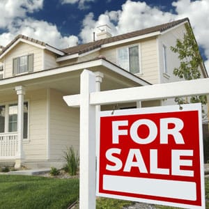 Image of For Sale sign in front of house