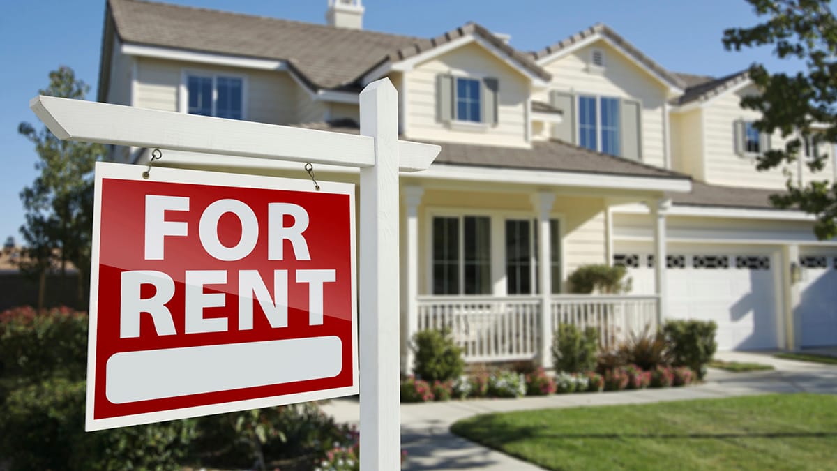Image of home with For Rent sign in front yard