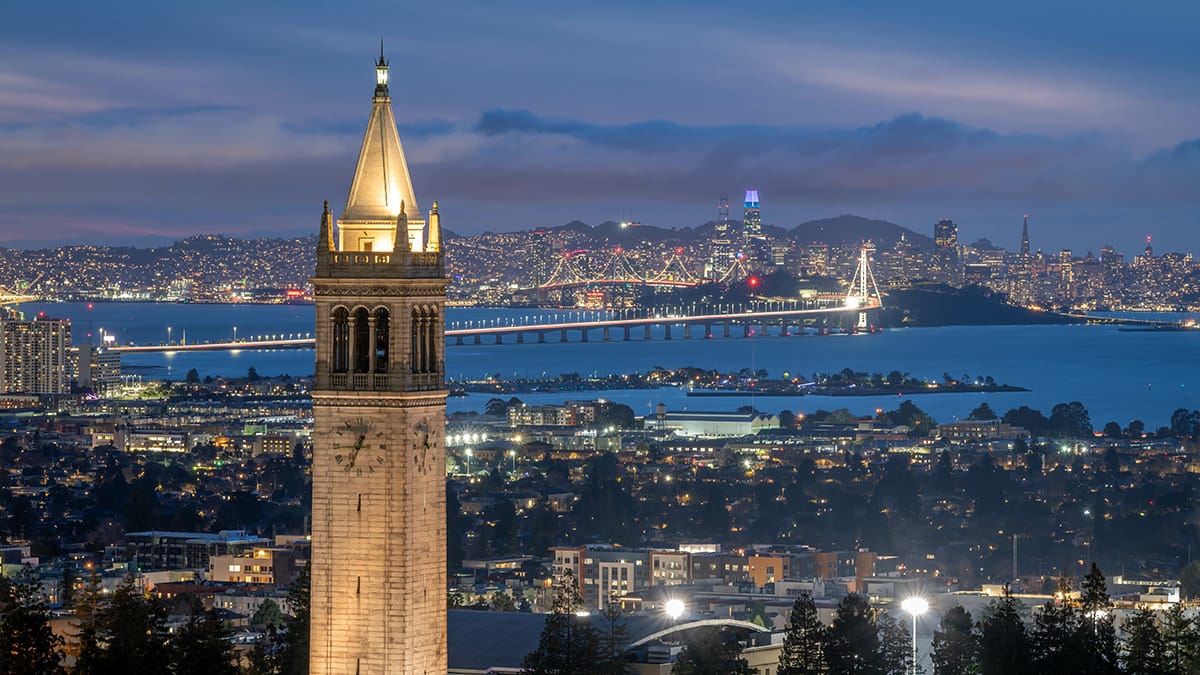 The Campanile at UC Berkeley with San Francisco and Sales Force tower in the background at sunrise highlighting property management in Berkeley by All East Bay Properties