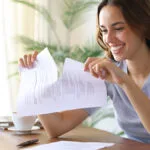 Image of a woman tearing up a contract and breaking her lease stress free