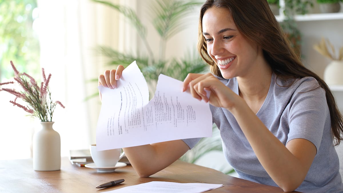 Image of a lease break with a woman tearing up her lease document